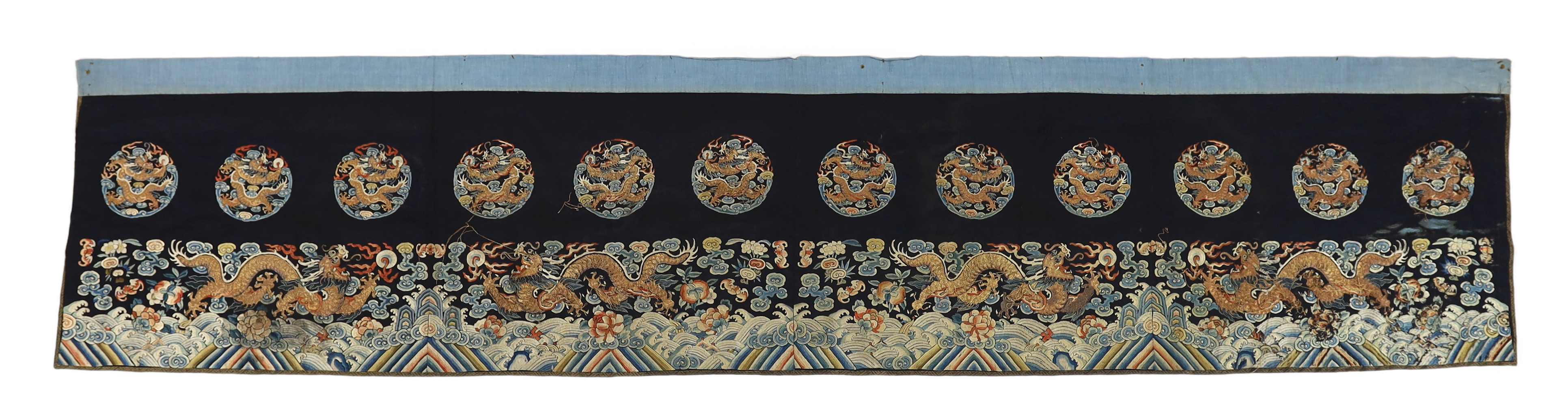 A Chinese embroidered silk 'dragon' table frontal, 19th century, damage